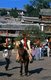 China: Naxi horseman in Old Market Square (Sifang Jie), Lijiang Old Town, Yunnan Province