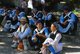 China: Naxi women relax in the Old Market Square (Sifang Jie), Old Town, Lijiang, Yunnan Province